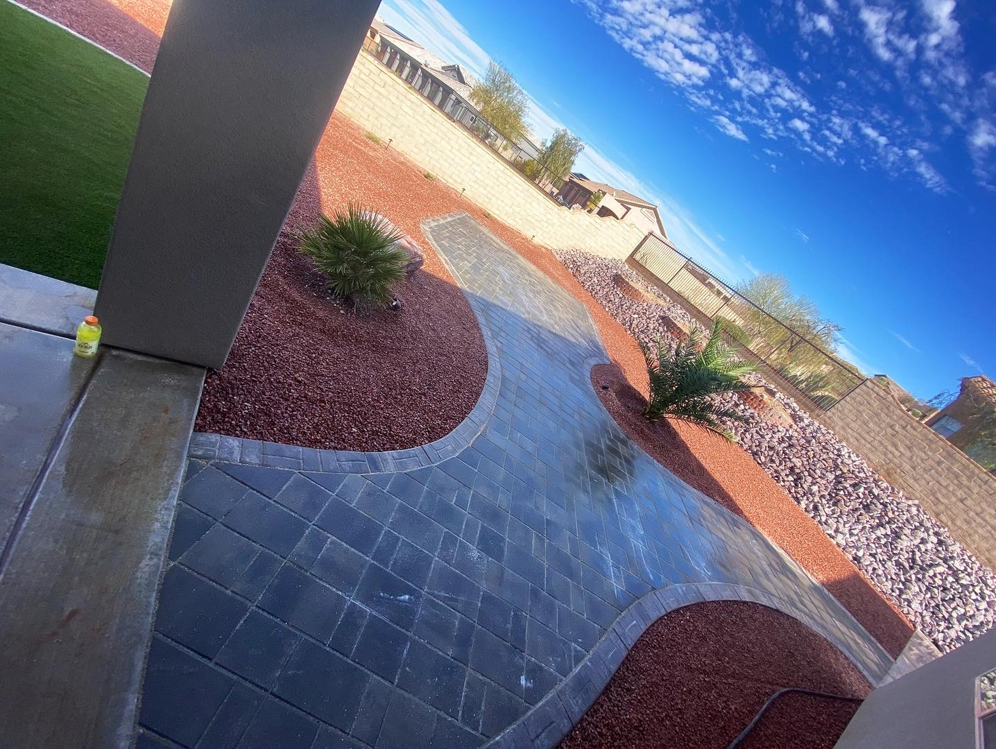 Custom paver patio with decorative rock landscaping