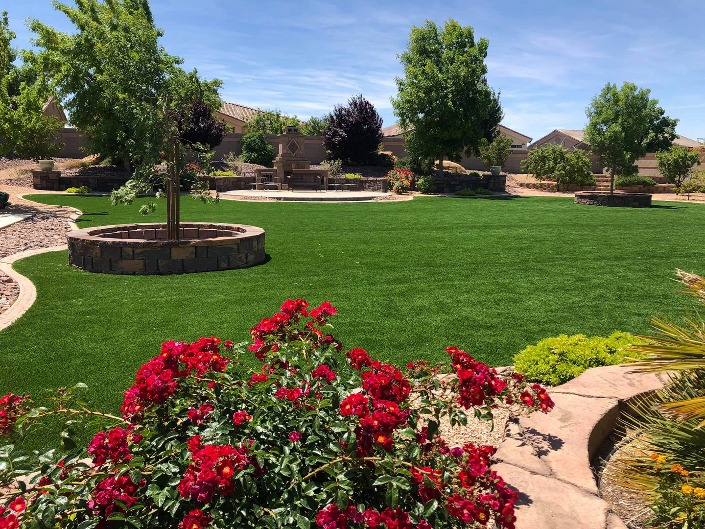 Lush green lawn with rose garden landscaping in the Tri-State Area